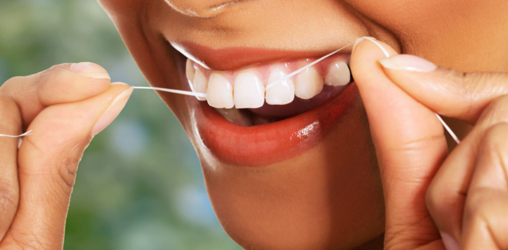 woman flossing