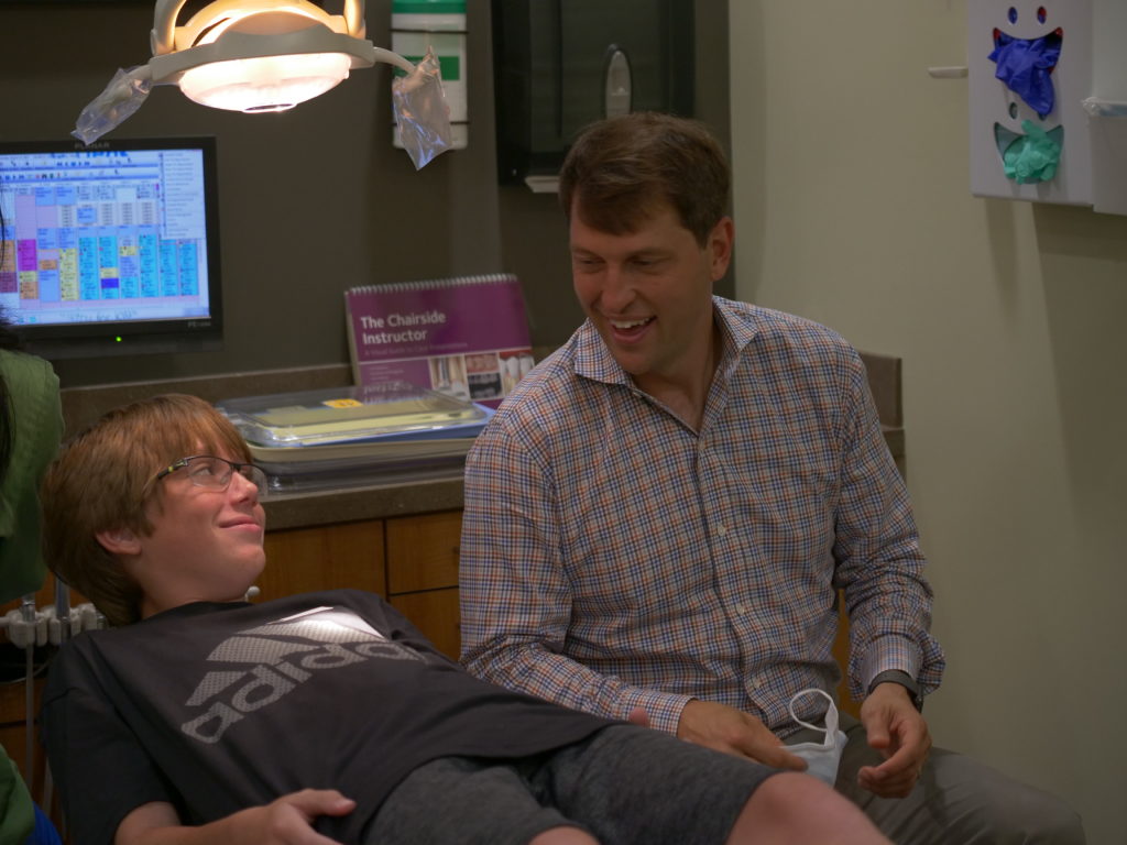 doctor talking to a patient after treatment