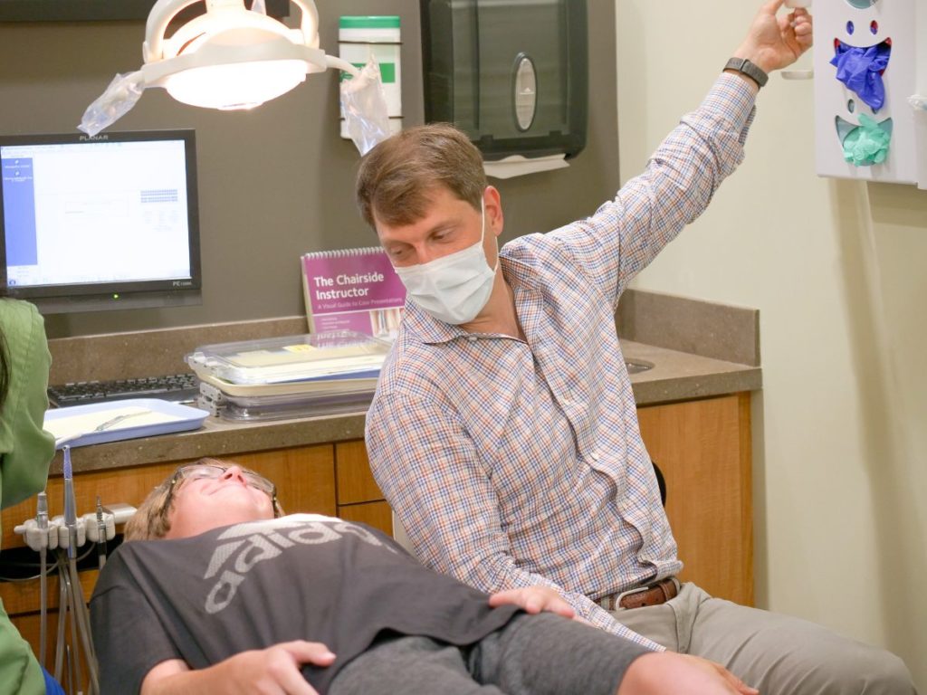 Doctor talking to young patient