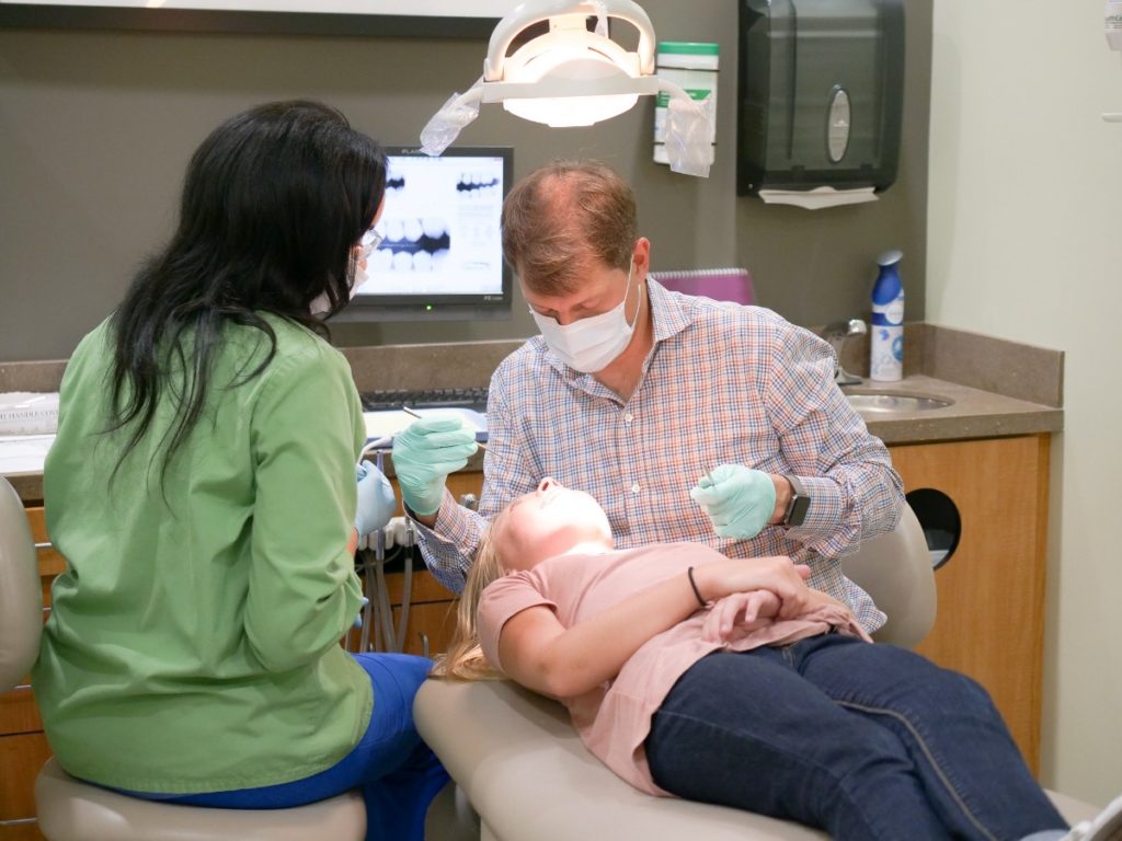 Children's Dental Center dentist with child patient